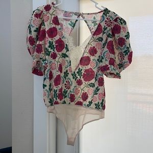 NWT free people body suit with lace detail and open back